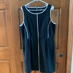 Sleeveless black dress, white trim, size XL.